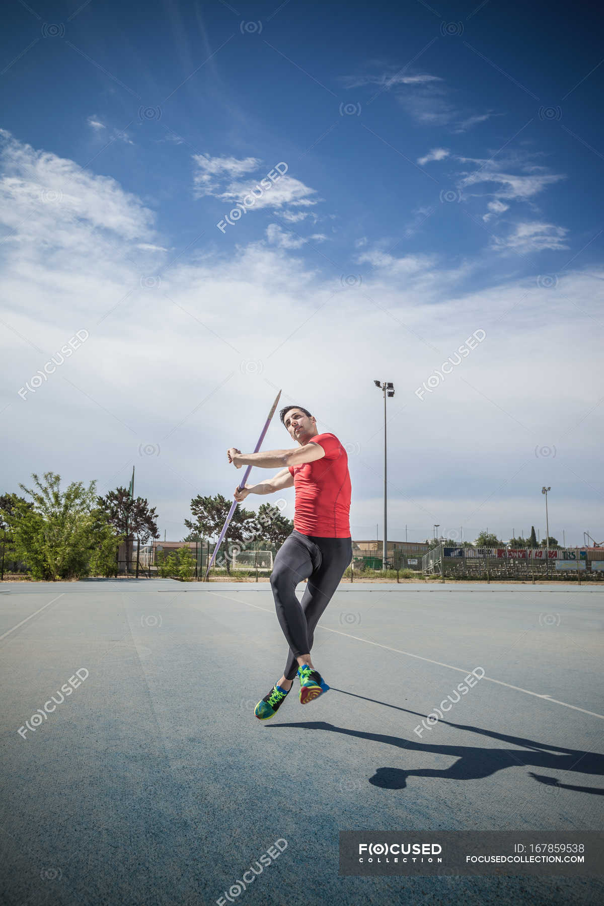 Man throwing javelin in sports ground — T shirt, recreation - Stock ...