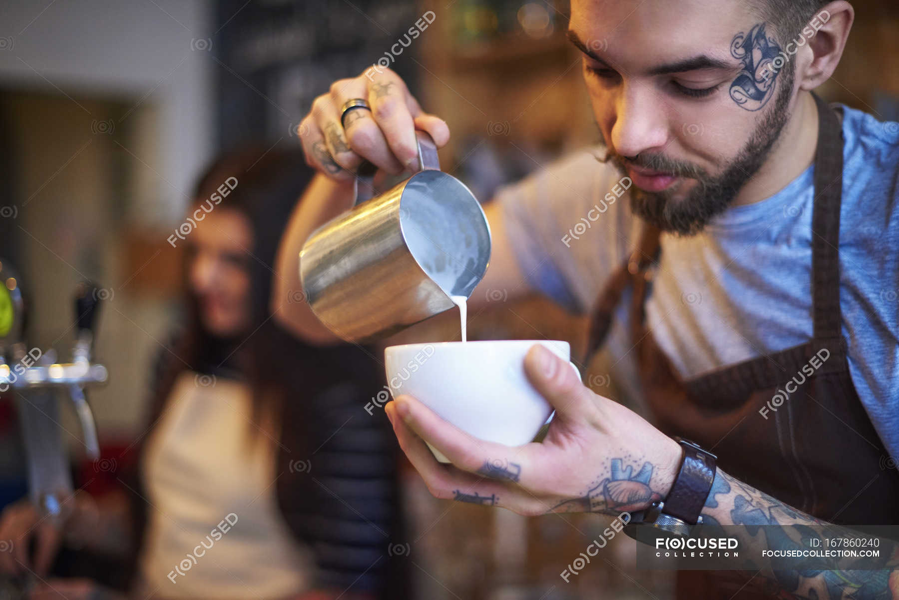 Barista Making Coffee In Coffee Shop Looking Down Tattoo Stock Photo 167860240