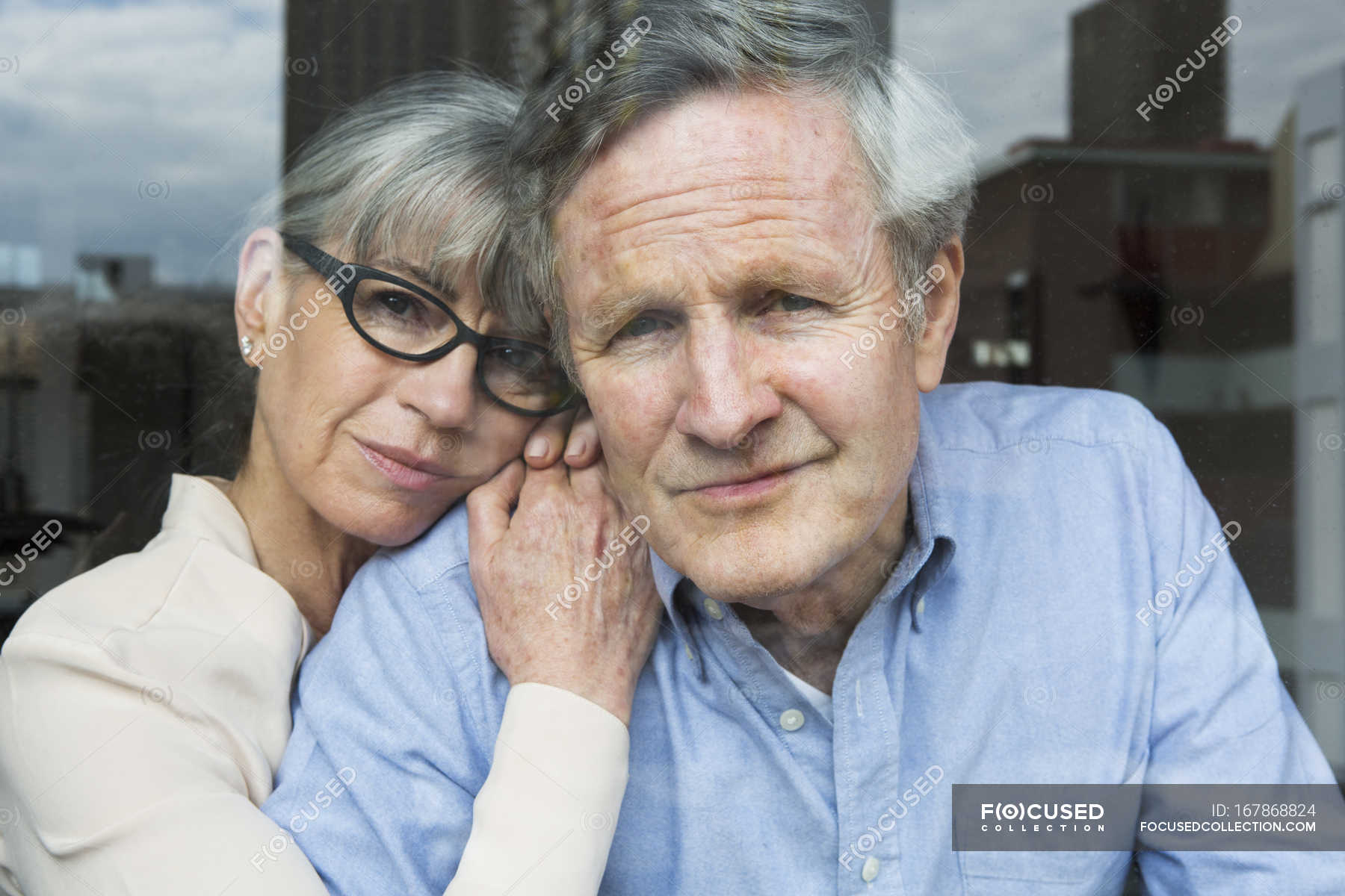 Couple looking through window — man, male - Stock Photo | #167868824