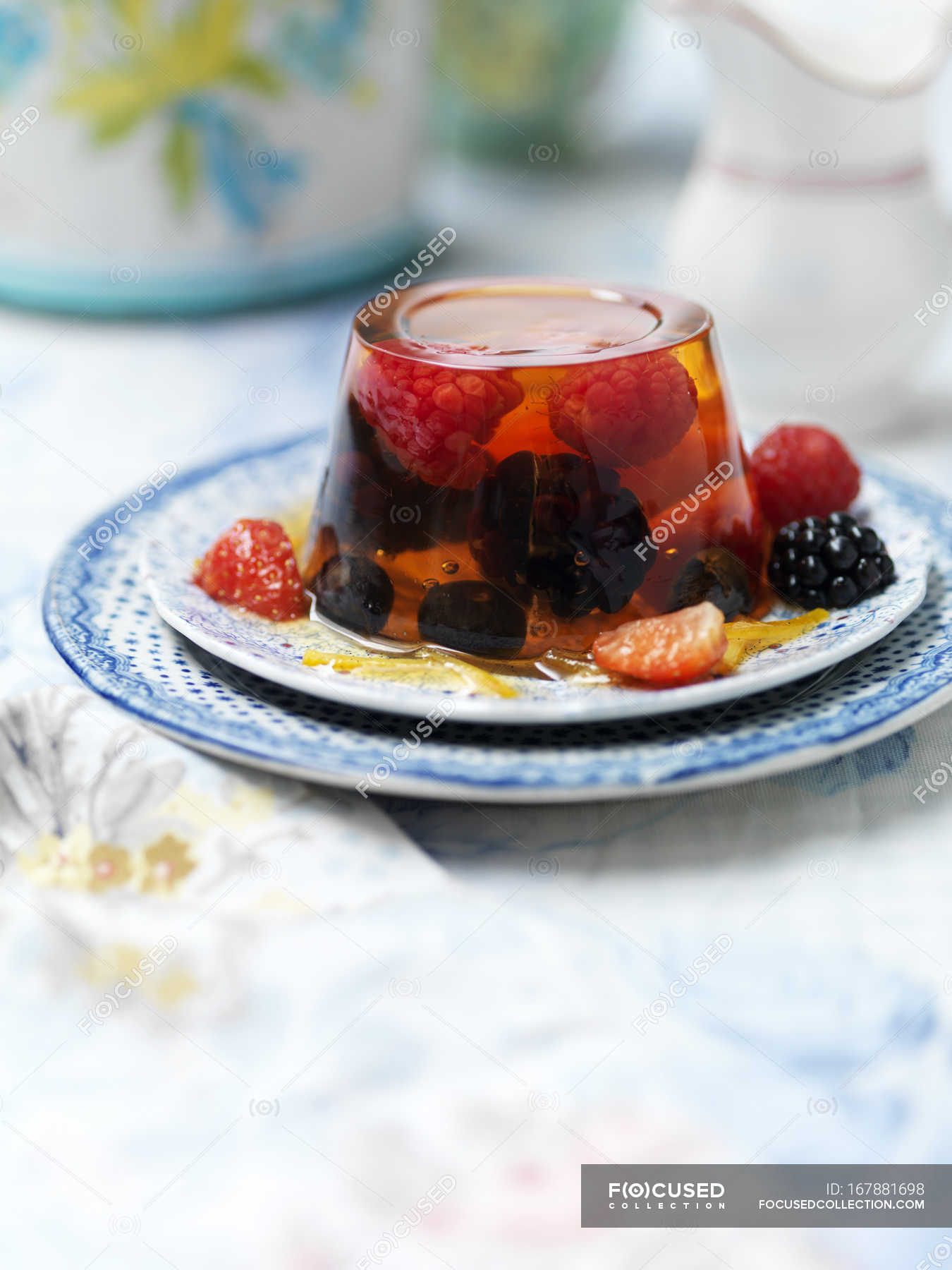 Fruit jelly dessert with fresh berries on plate — organic, natural ...