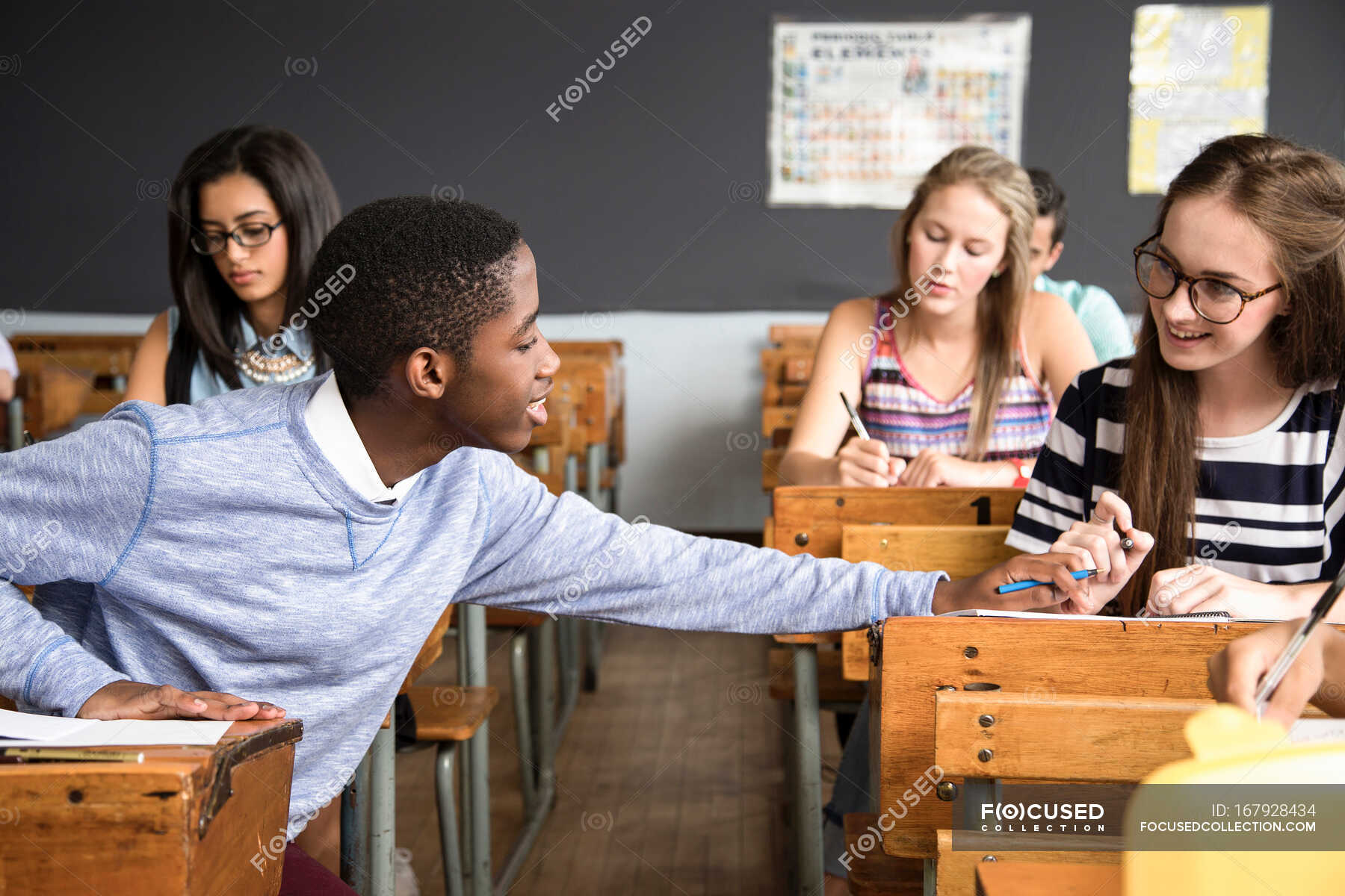 The students would like. Как сидят студенты на занятии картинка. Sitting student. Teacher squatting helping student, looking back. Suggested him working.