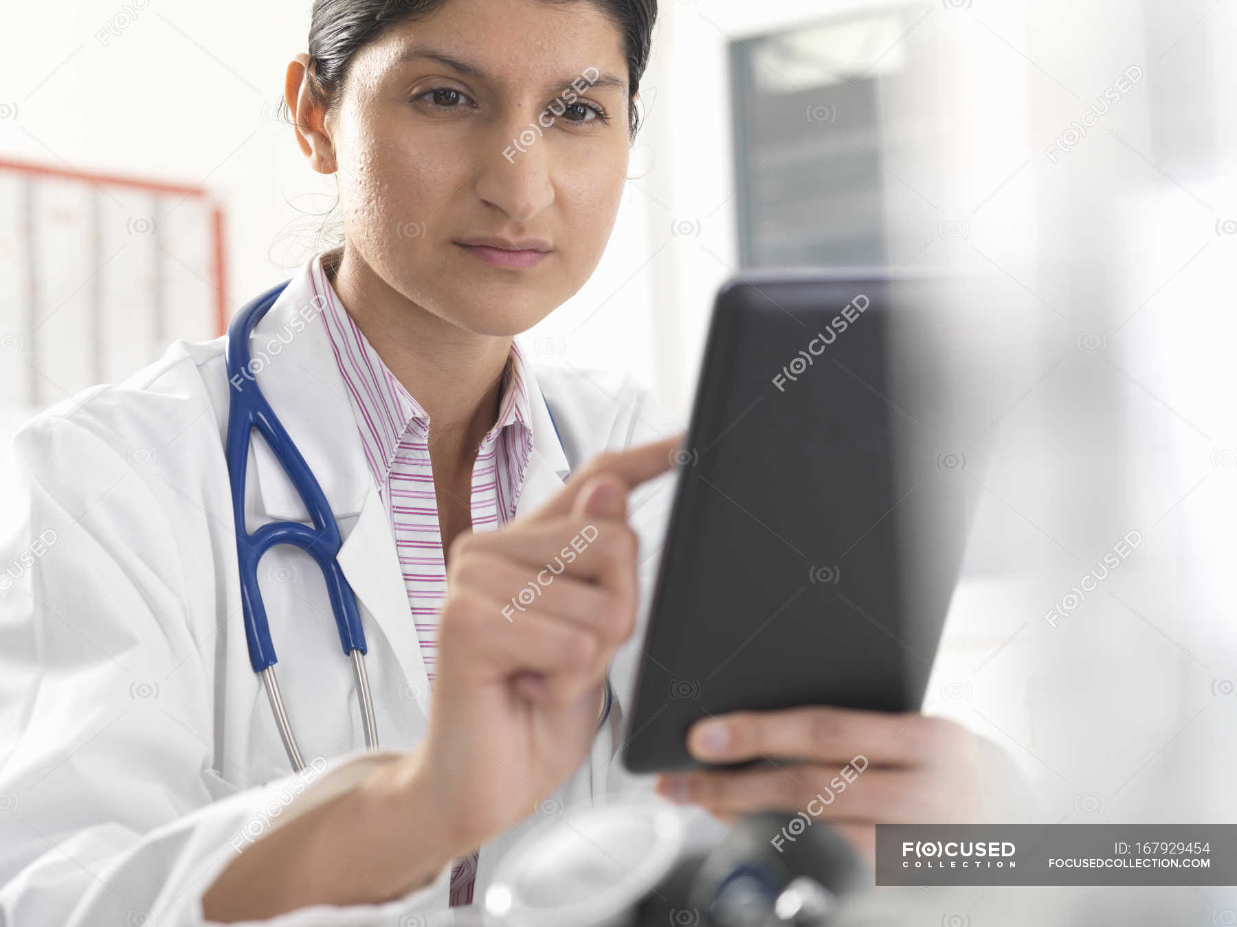 female-doctor-using-digital-tablet-touchscreen-for-medical-records