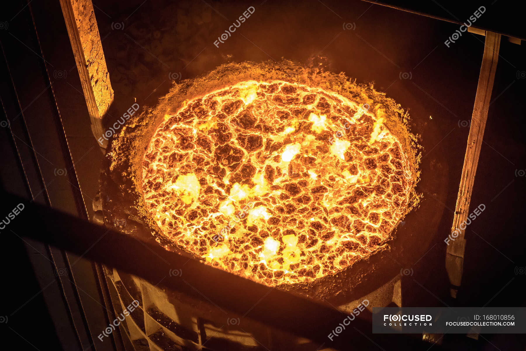 Download High Angle View Of Molten Steel Flask In Steelworks Illuminated Workshop Stock Photo 168010856 PSD Mockup Templates