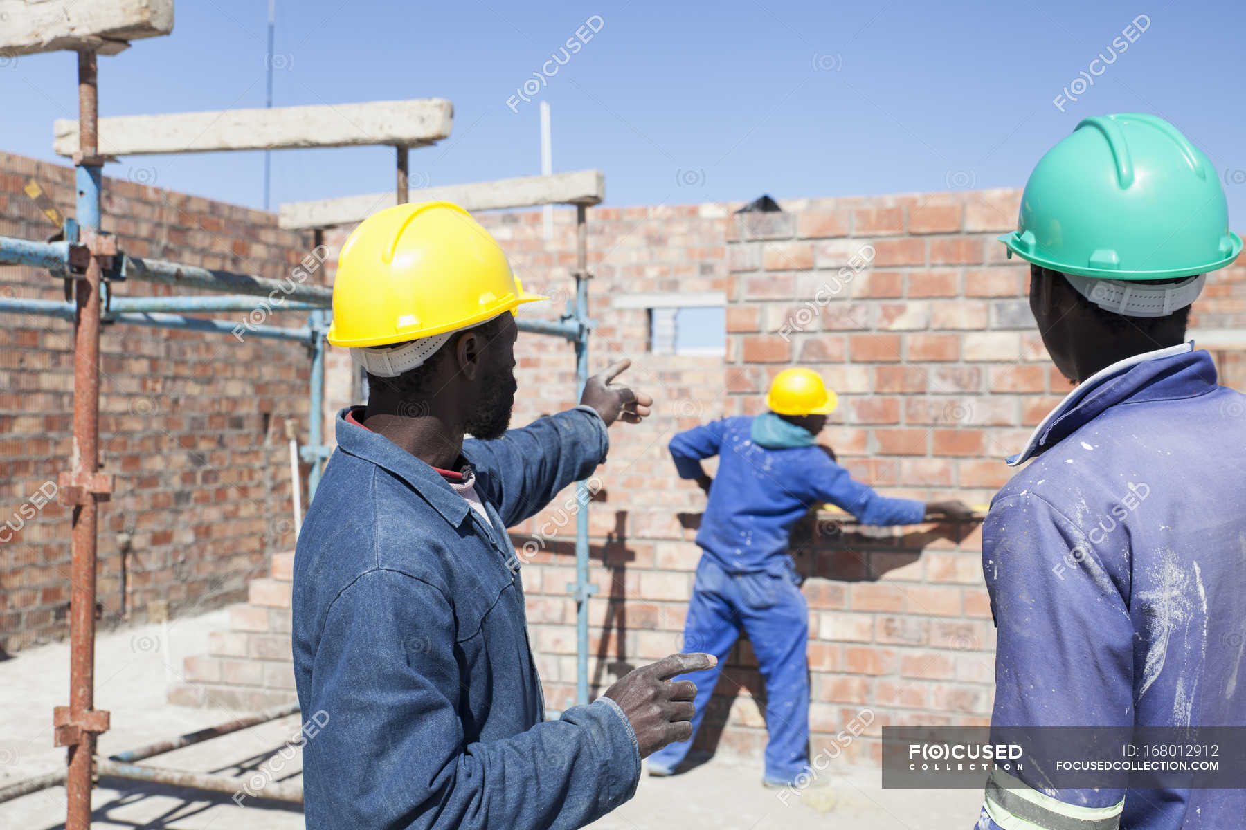 African Builders working on construction site — Guidance, Men - Stock