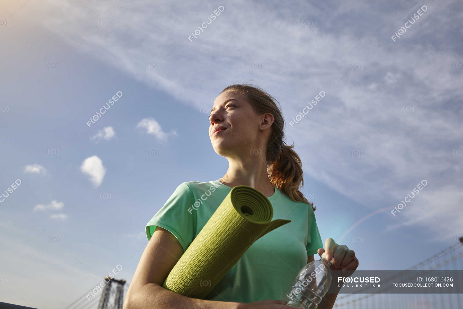 Woman Carrying Yoga Mat Looking Away Manhattan New York Usa