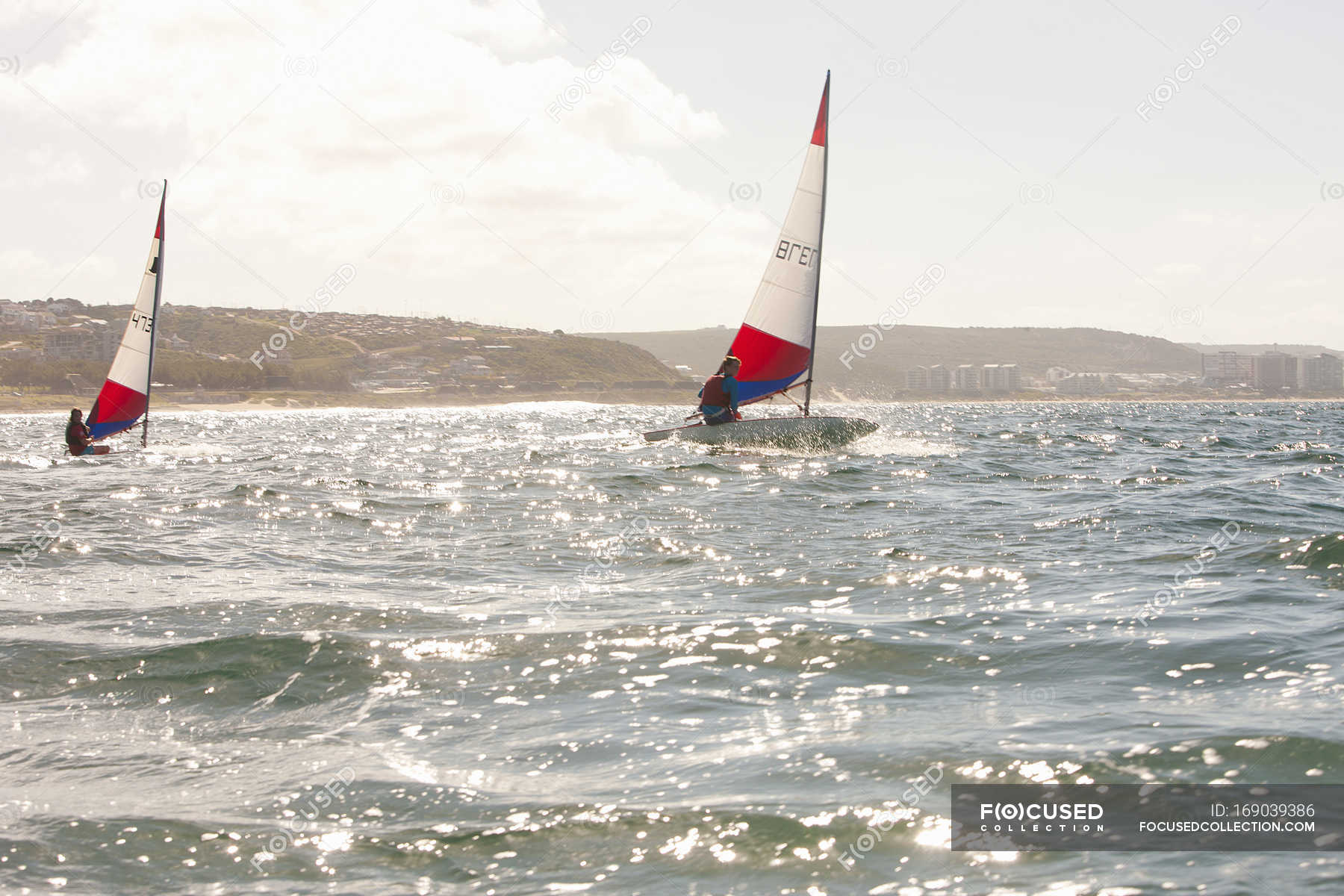 Teenagers sailing boats in sea water — teenage boy, male - Stock Photo ...