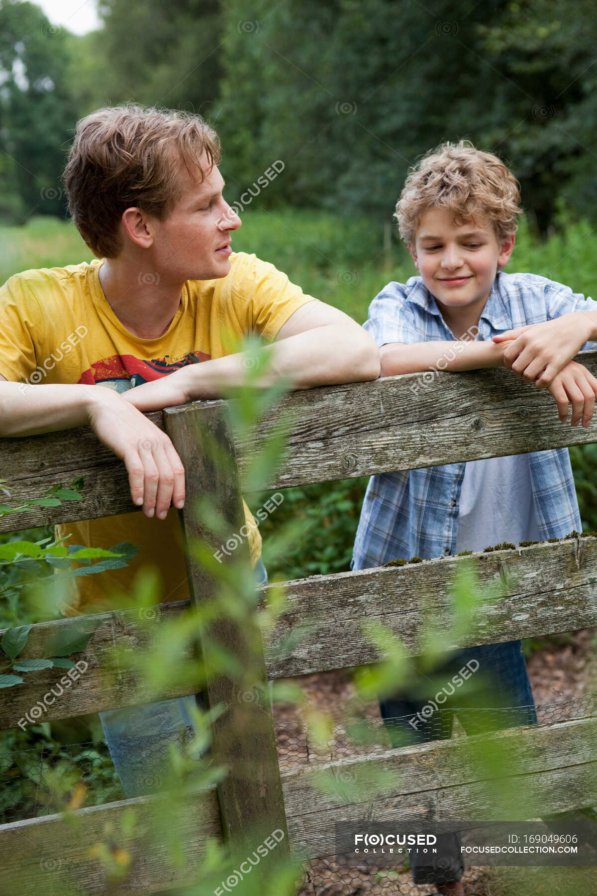 young-boy-with-older-brother-leisure-rural-stock-photo-169049606