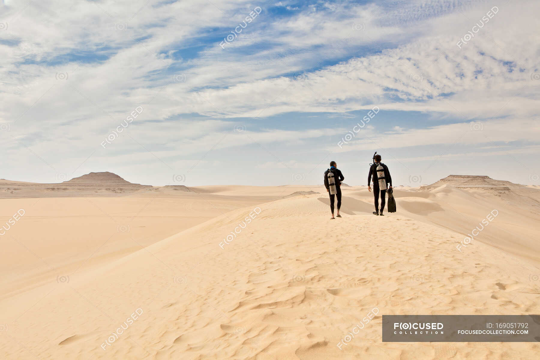 Two men in wetsuits, Great Sand Sea, Sahara Desert, Egypt, Africa
