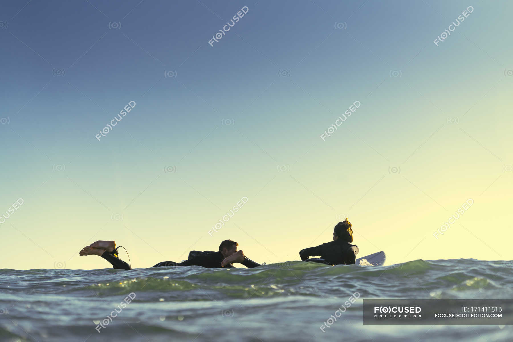 Surfing Couple Paddling Surfboards At Sea Newport Beach California Usa — Wet Suits Side View 6014