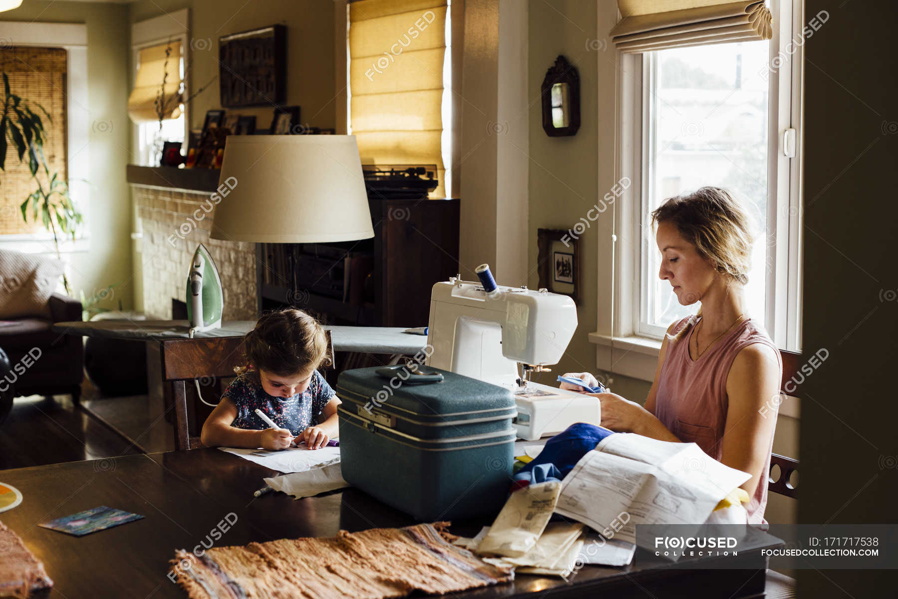 family sitting at table baby coloring pages        
        <figure class=