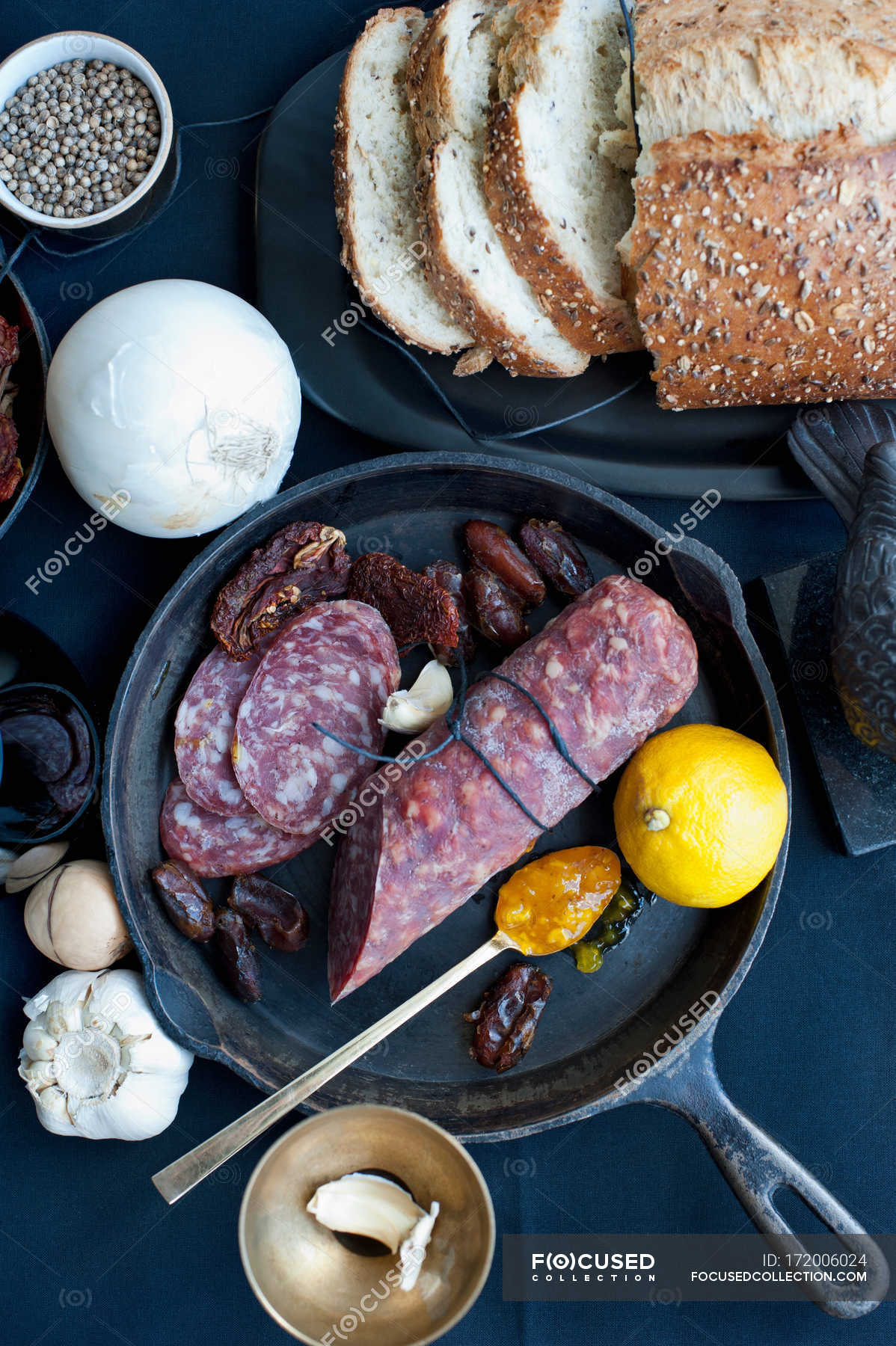 Salami with lemon and bread — indoors, date Stock Photo 172006024