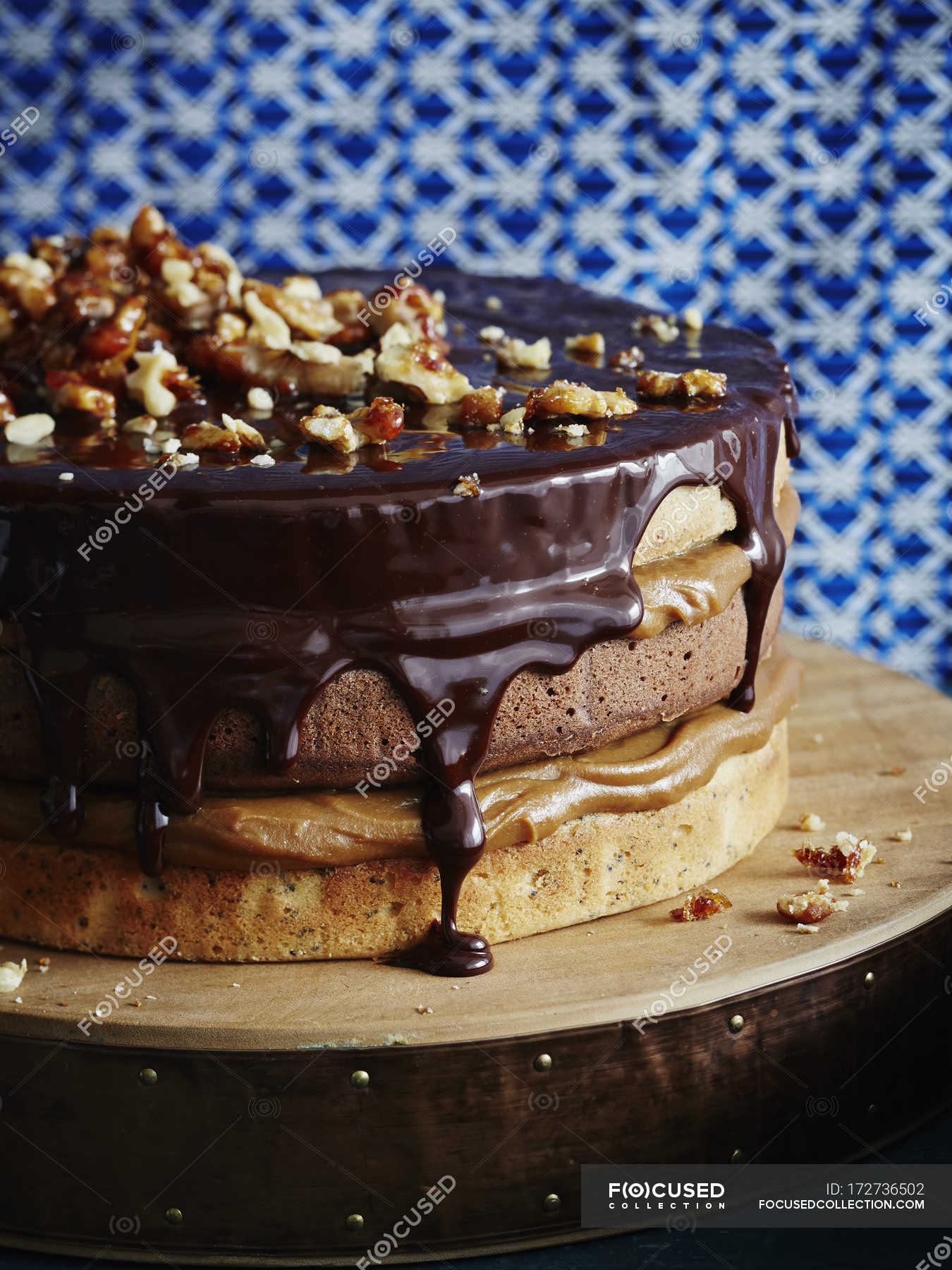 Triple layer chocolate caramel cake with walnuts — dripping, chocolate ...