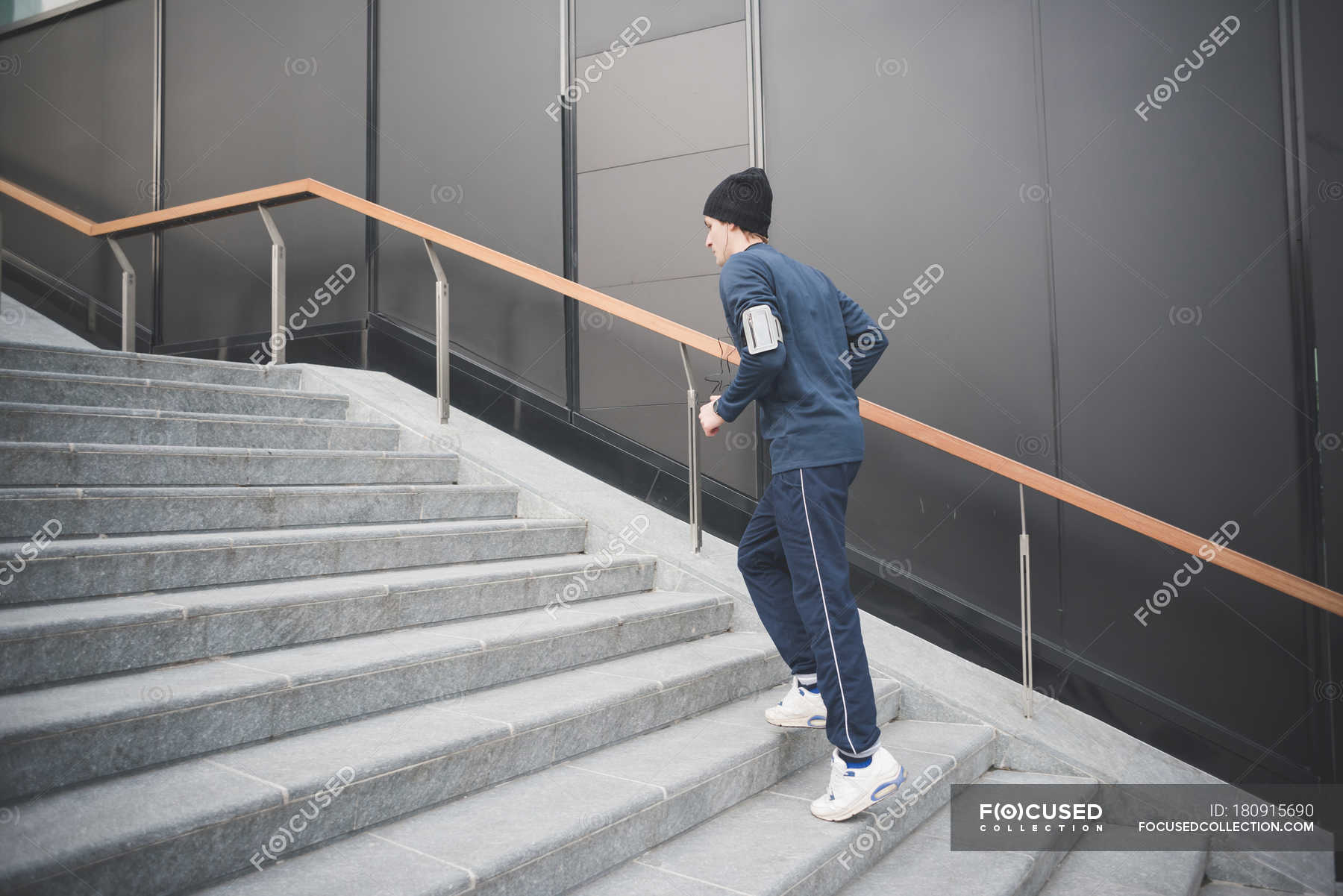 Young Male Runner Moving Up City Stairs Side View One Person Young Male Runner Moving Up City Stairs Side View One Person Stock Photo 180915690