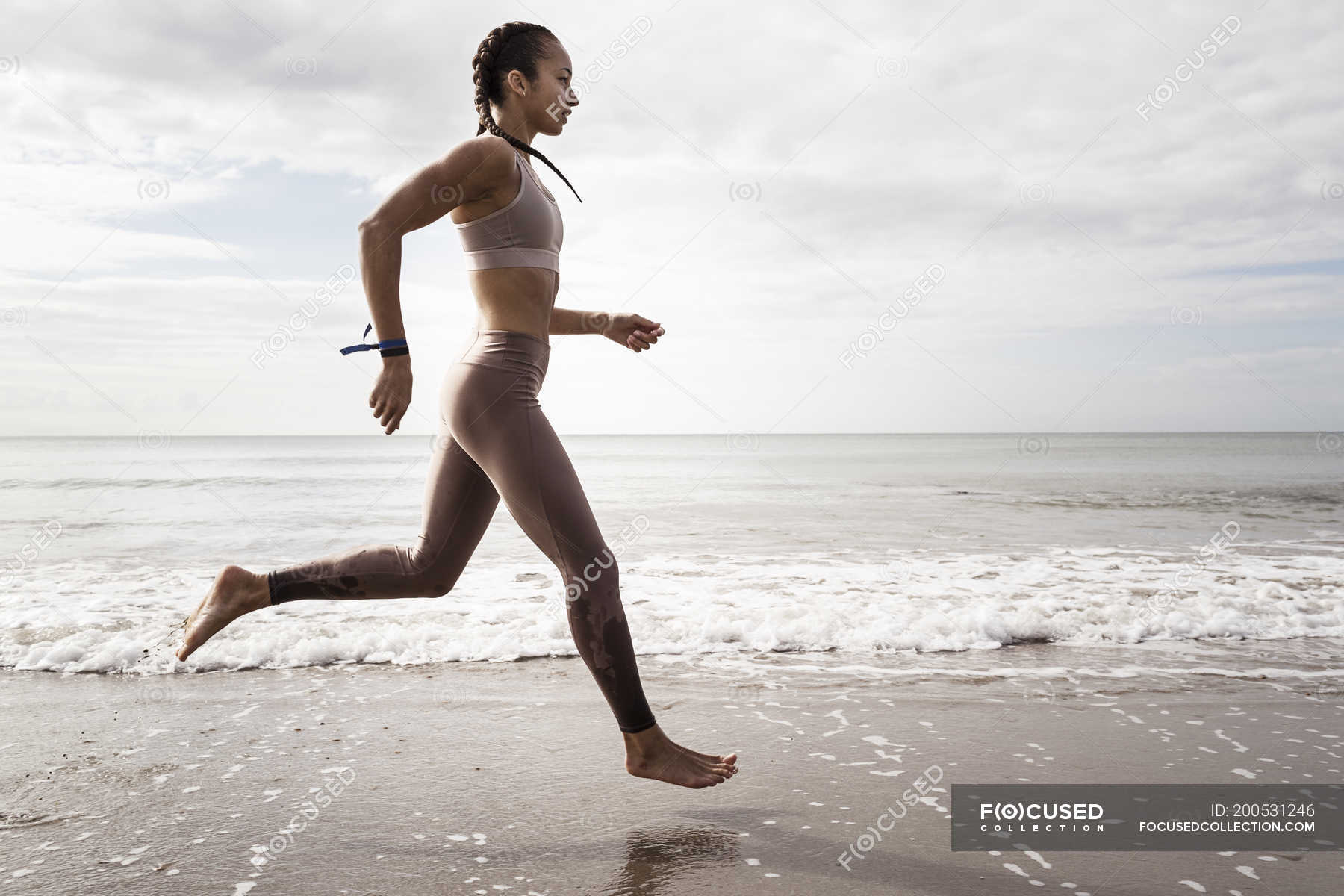 running on beach barefoot