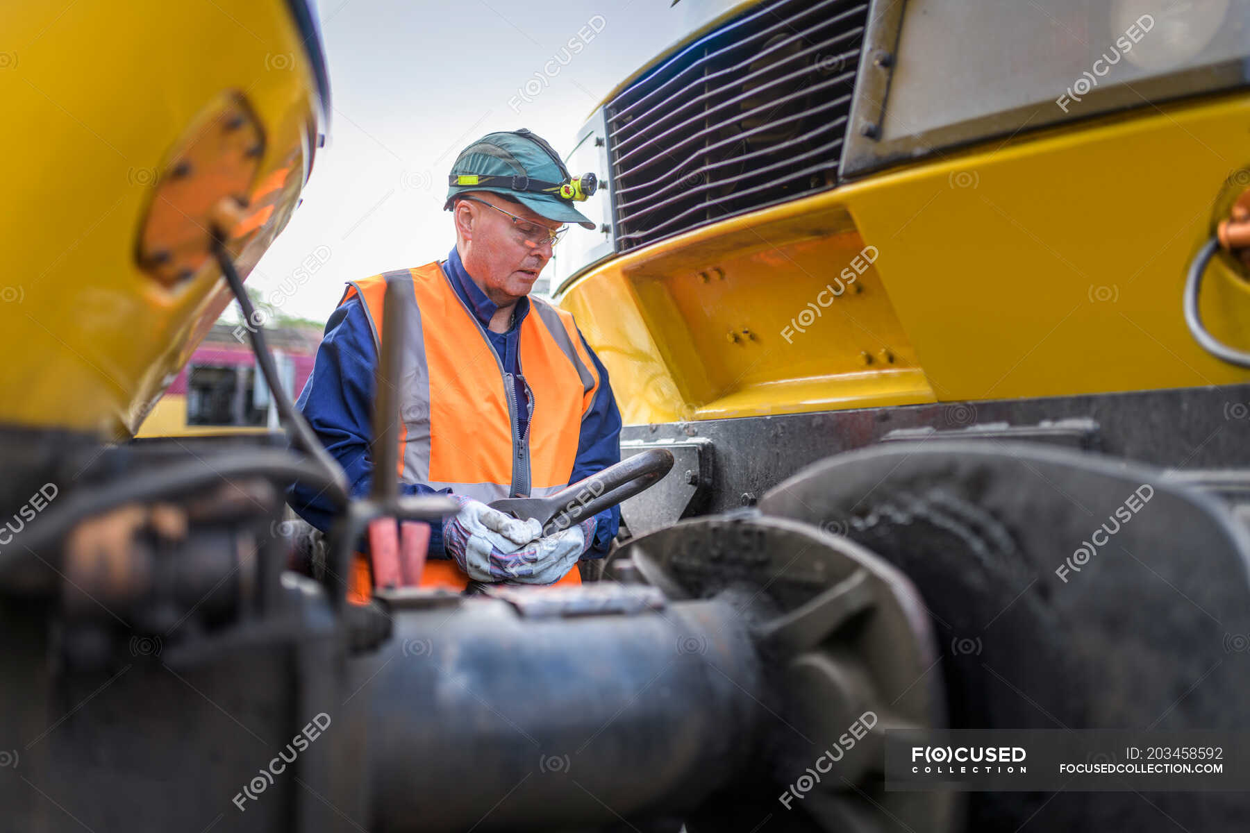 engineer-hitching-one-locomotive-to-another-in-train-engineering