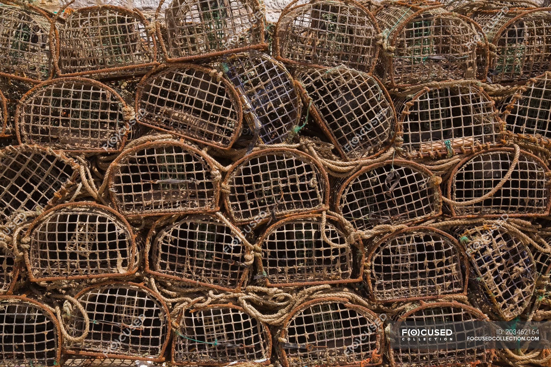 Stacks of commercial crab fishing baskets, Portugal — in high