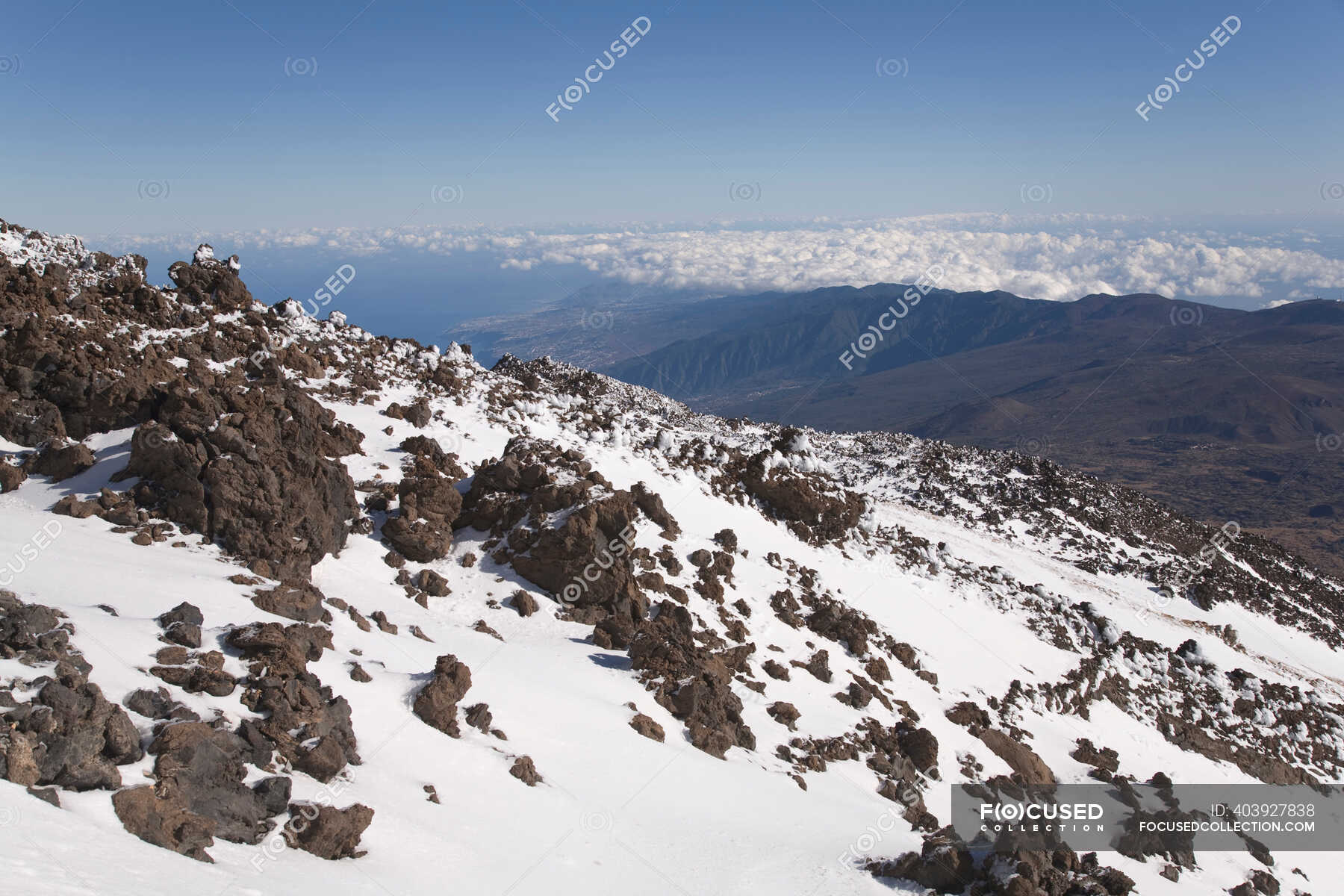 Snow On Rocky Mountainside Winter Scenics Stock Photo