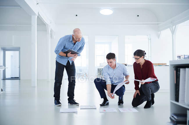 Colleagues working in open plan office — Stock Photo