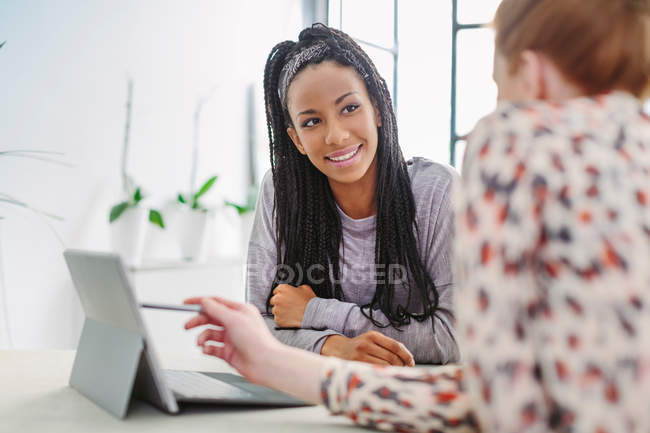 Colleagues using digital tablet — Stock Photo