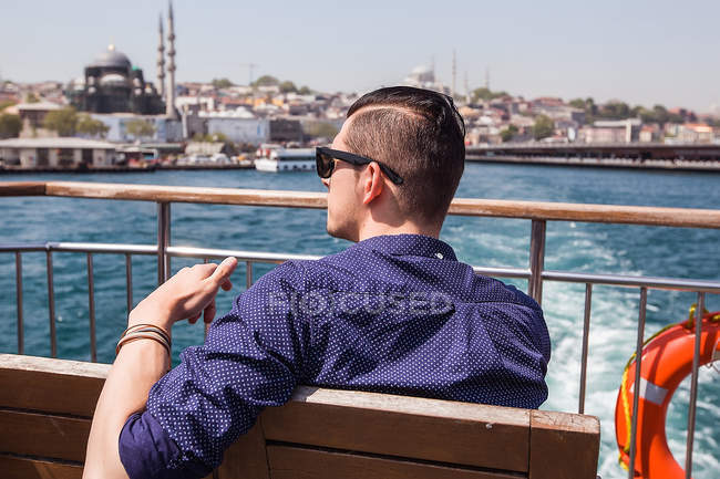 Tourist on passenger ferry deck — Stock Photo