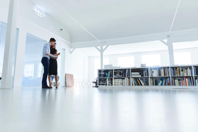 Colleagues in open plan office — Stock Photo