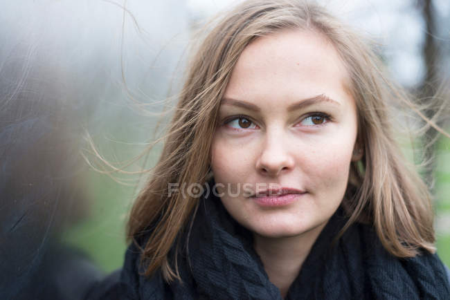 Young woman with flyaway hair — Stock Photo