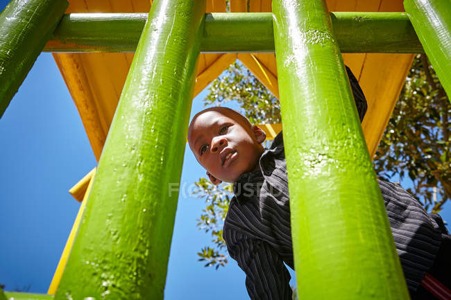 Boy on climbing frame — Stock Photo