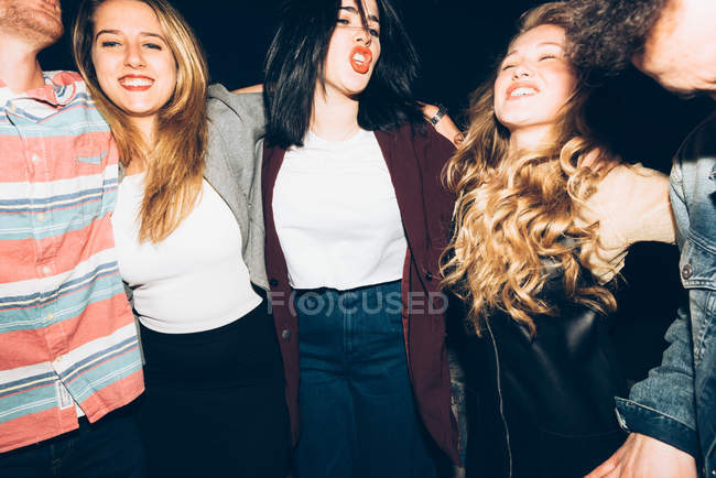 Portrait of group of friends at night — Stock Photo