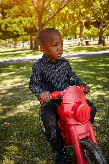 Boy riding motorcycle — Stock Photo