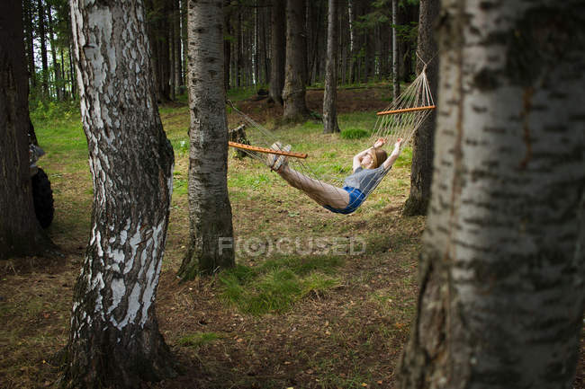 Woman resting in hammock — Stock Photo