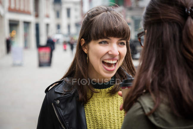 Women chatting in street — Stock Photo