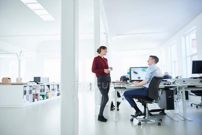Colleagues in open plan office — Stock Photo