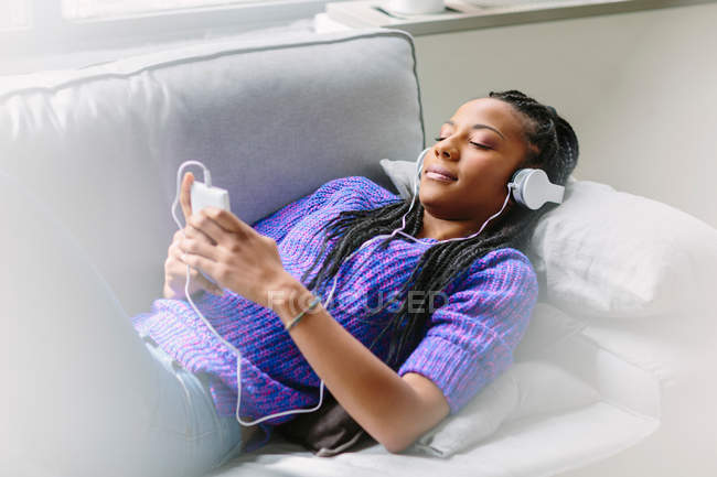 Woman wearing headphones — Stock Photo