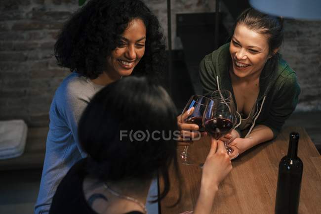 Friends drinking red wine — Stock Photo