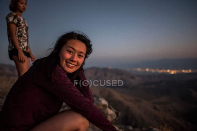 Portrait of young woman and friend — Stock Photo