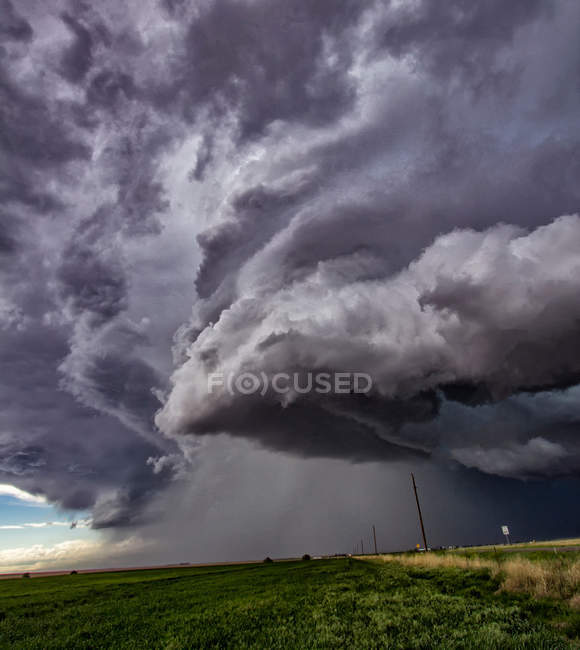 Rotating supercell clouds over rural area — Stock Photo
