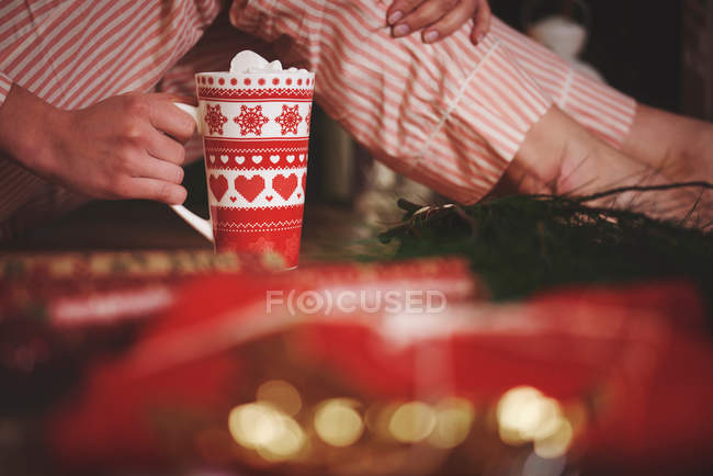 Woman holding hot chocolate — Stock Photo