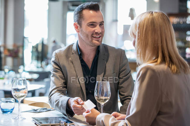 Businessman and businesswoman making introductions — Stock Photo