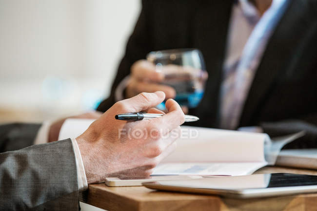Businessmen working and making notes of discussion — Stock Photo