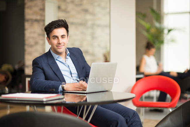 Businessman at office desk — Stock Photo
