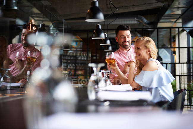 Couple laughing together at restaurant — Stock Photo