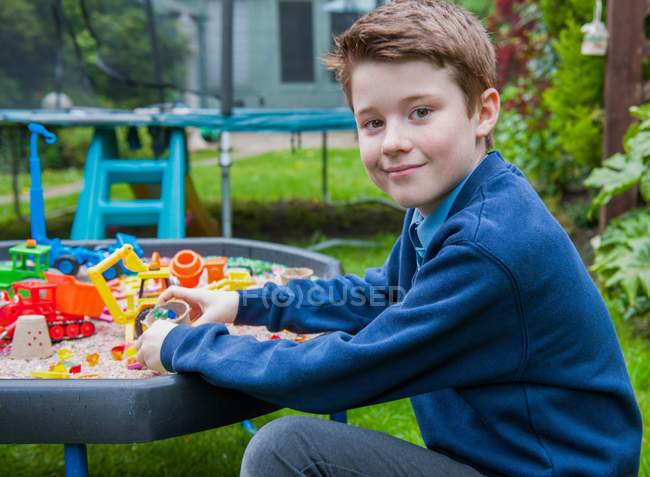 Boy playing in sandpit — Stock Photo