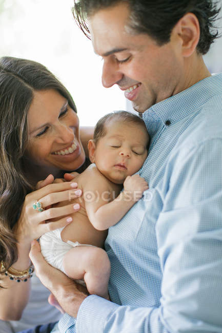 Mother and father, holding newborn — Stock Photo