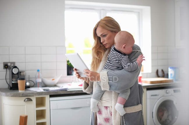 Mother holding baby boy — Stock Photo