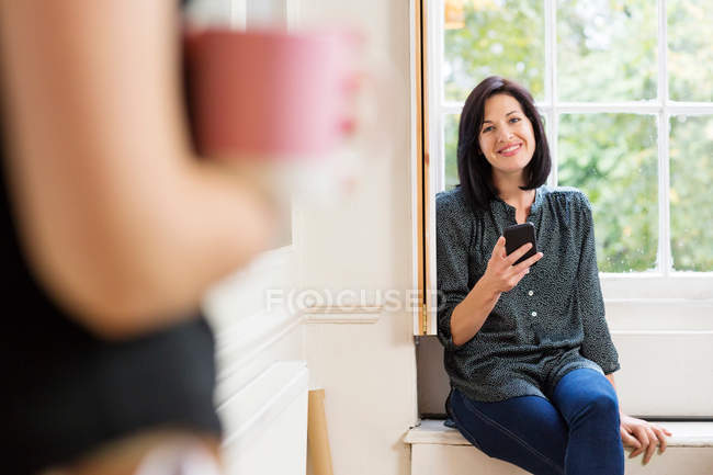 Female designer in window — Stock Photo