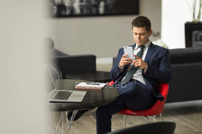 Businessman sitting in office — Stock Photo