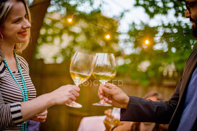 Man and woman at garden party — Stock Photo