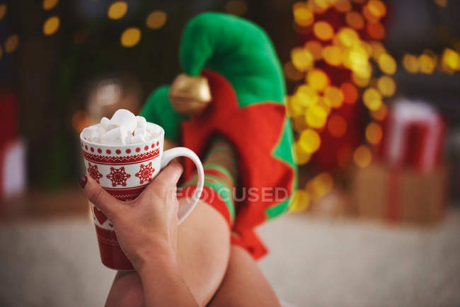 Woman holding hot chocolate with marshmallows — Stock Photo