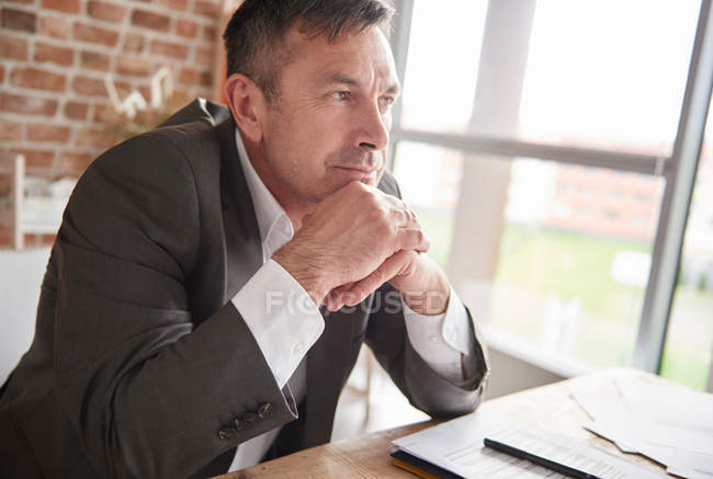 Man with hands on chin — Stock Photo