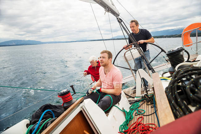 Three generation family on sailing boat — Stock Photo